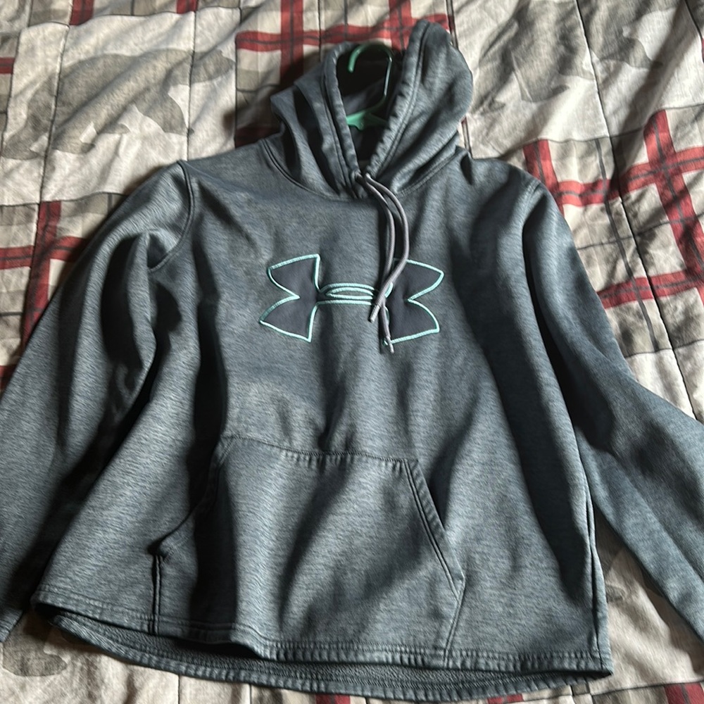 Small sweatshirt size small, loose fitting bluish grey with teal logo outline